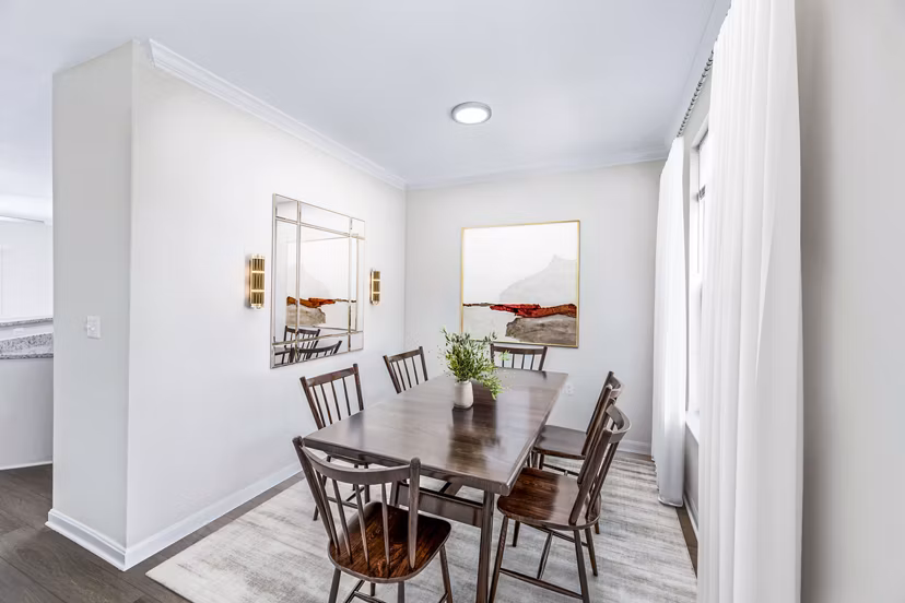 Dining room featuring elegant table setting and modern lighting in Townes at Herndon Apartments