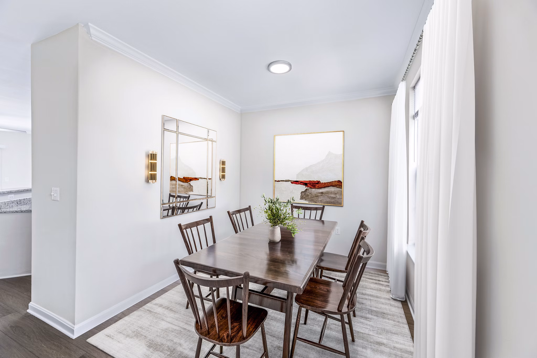 Dining room featuring elegant table setting and modern lighting in Townes at Herndon Apartments