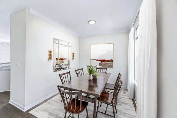 Dining room featuring elegant table setting and modern lighting in Townes at Herndon Apartments