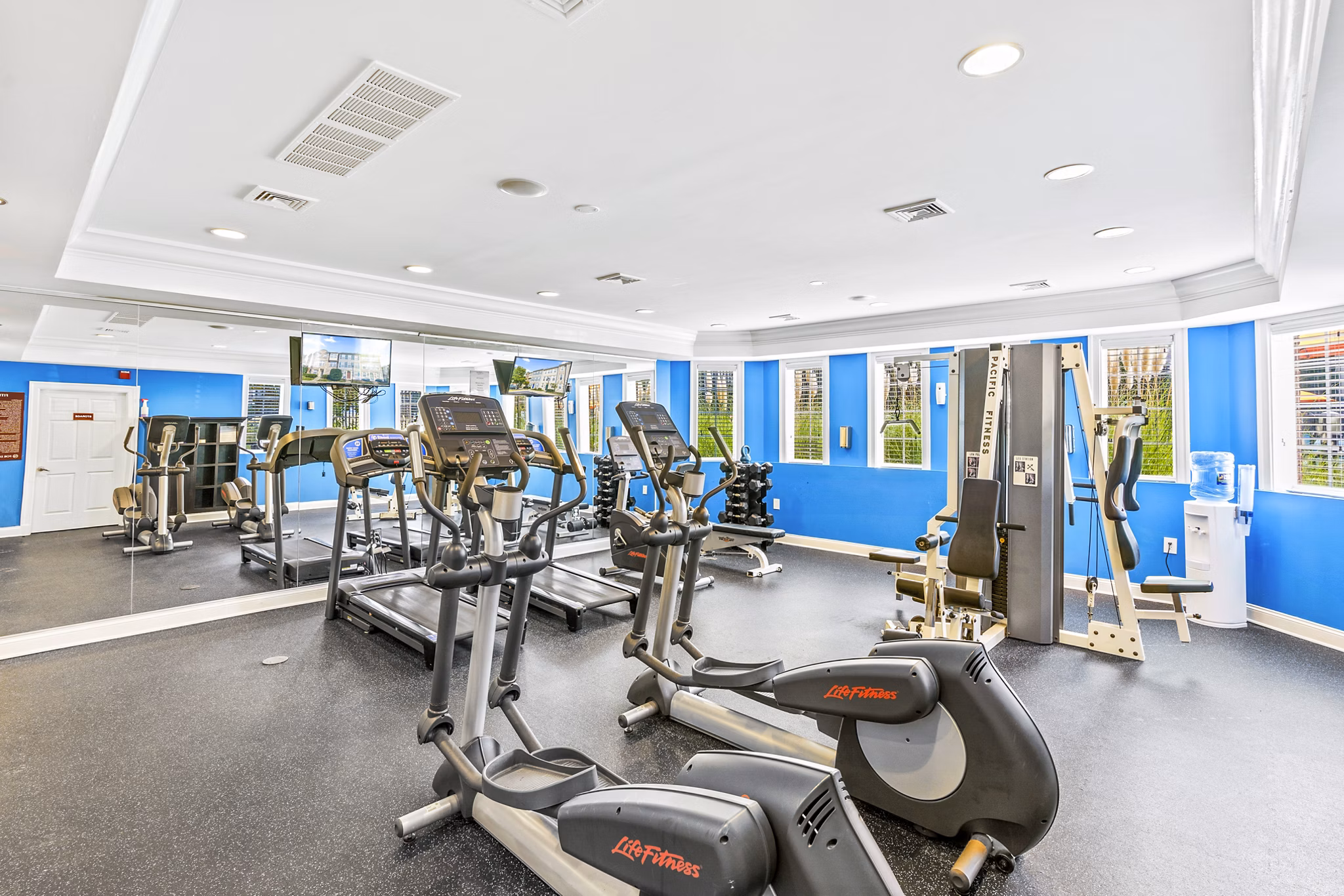 Fitness center with modern equipment at Townes at Herndon Apartments
