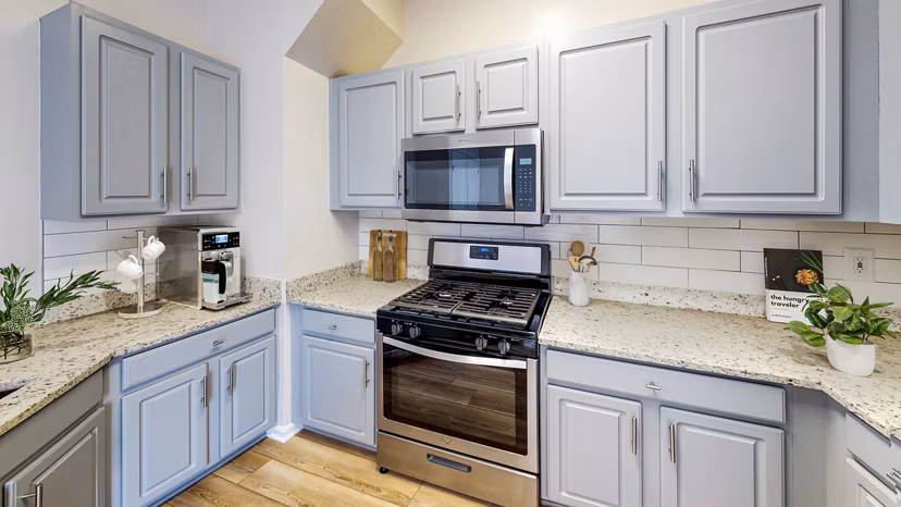 Modern kitchen with stainless steel appliances at Townes at Herndon Apartments