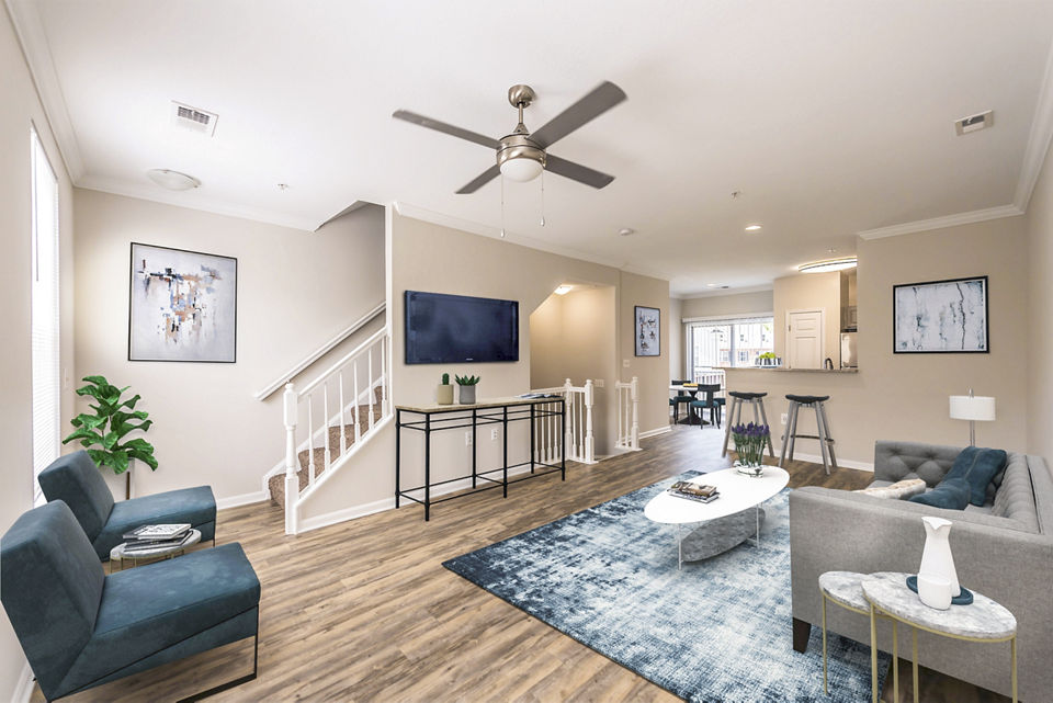 Spacious living room with modern furnishings in Townes at Herndon Apartments