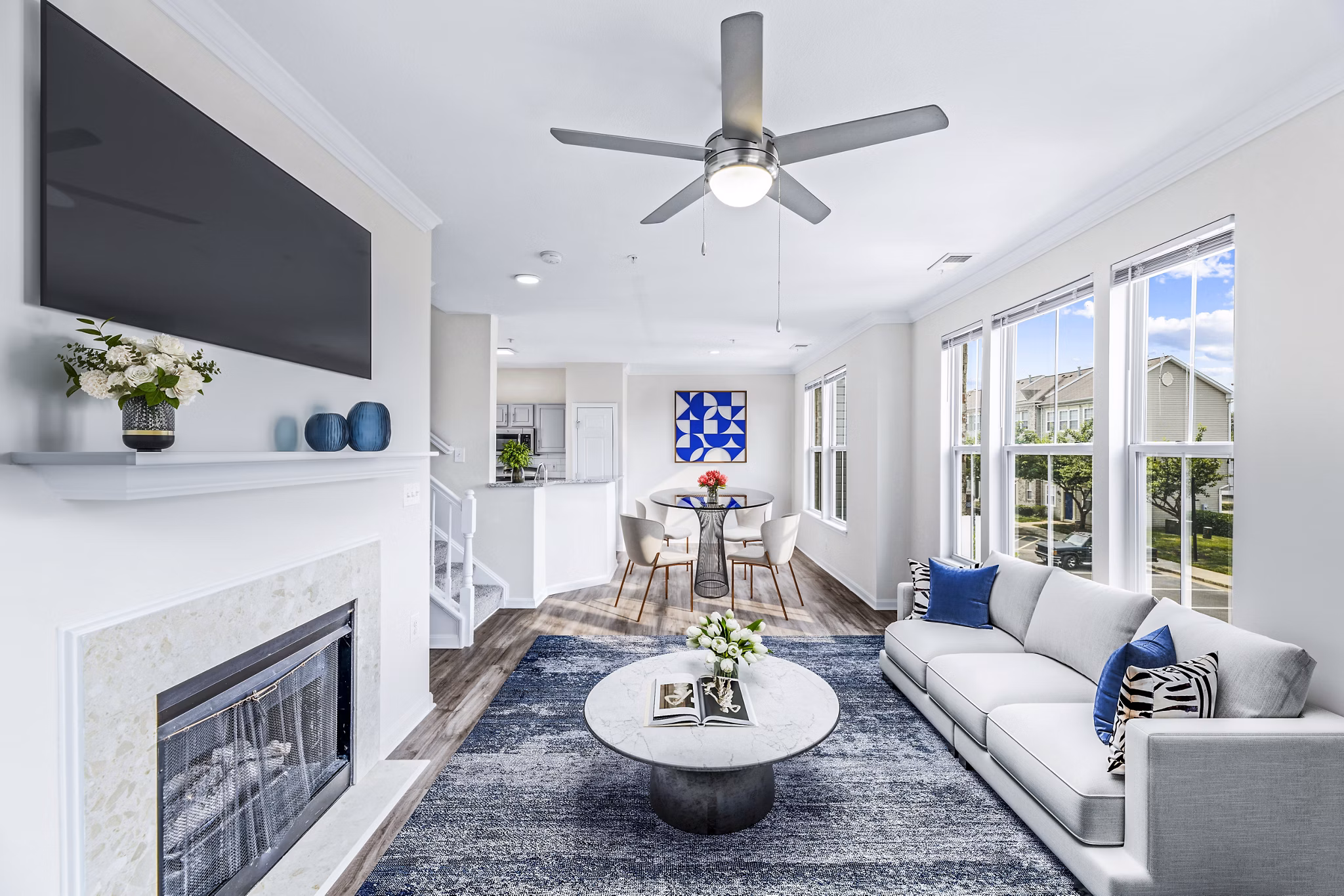 Cozy living room with modern furnishings and natural light at Townes at Herndon Apartments