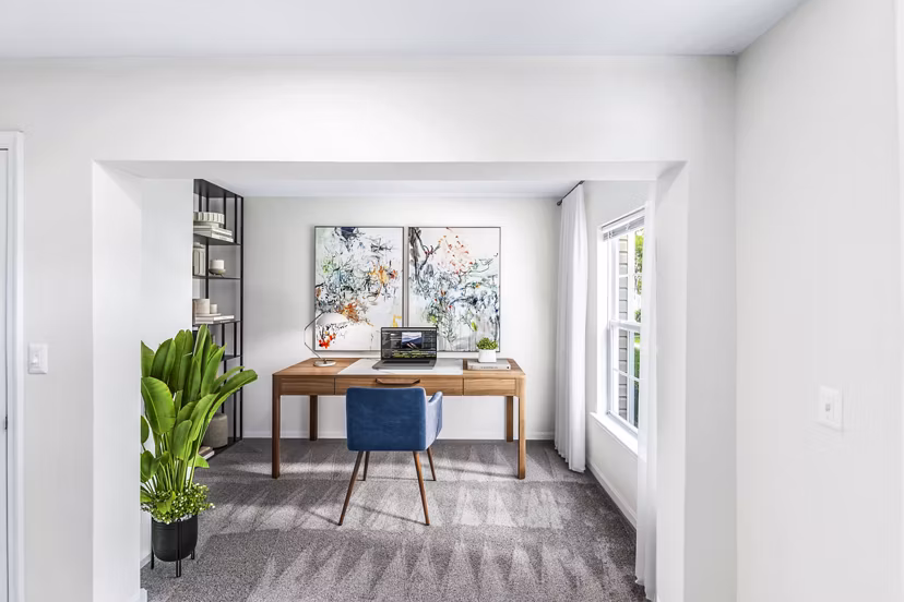 Cozy home office with ergonomic desk and chair at Townes at Herndon Apartments, perfect for remote work environments