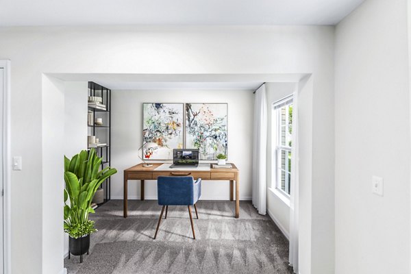 Cozy home office with ergonomic desk and chair at Townes at Herndon Apartments, perfect for remote work environments