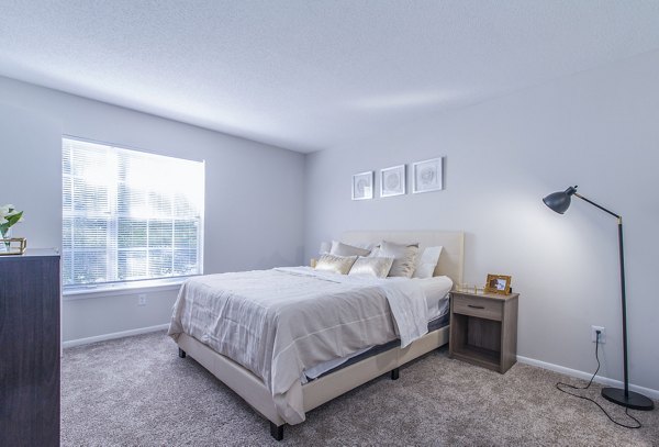 Cozy bedroom with elegant decor at Windsor at Fairlakes Apartments