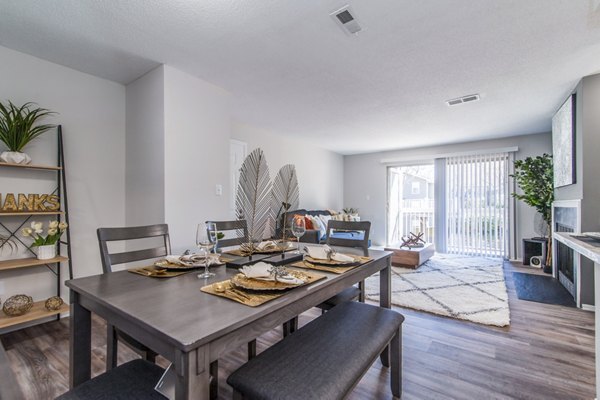 Dining area with elegant furnishings and modern lighting at Windsor at Fairlakes Apartments