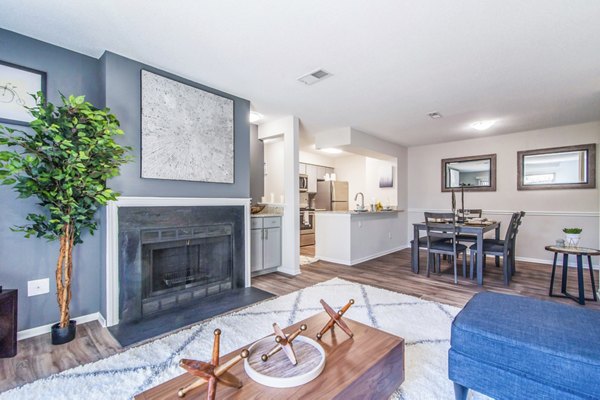 Modern living room with stylish furniture and natural light at Windsor at Fairlakes Apartments