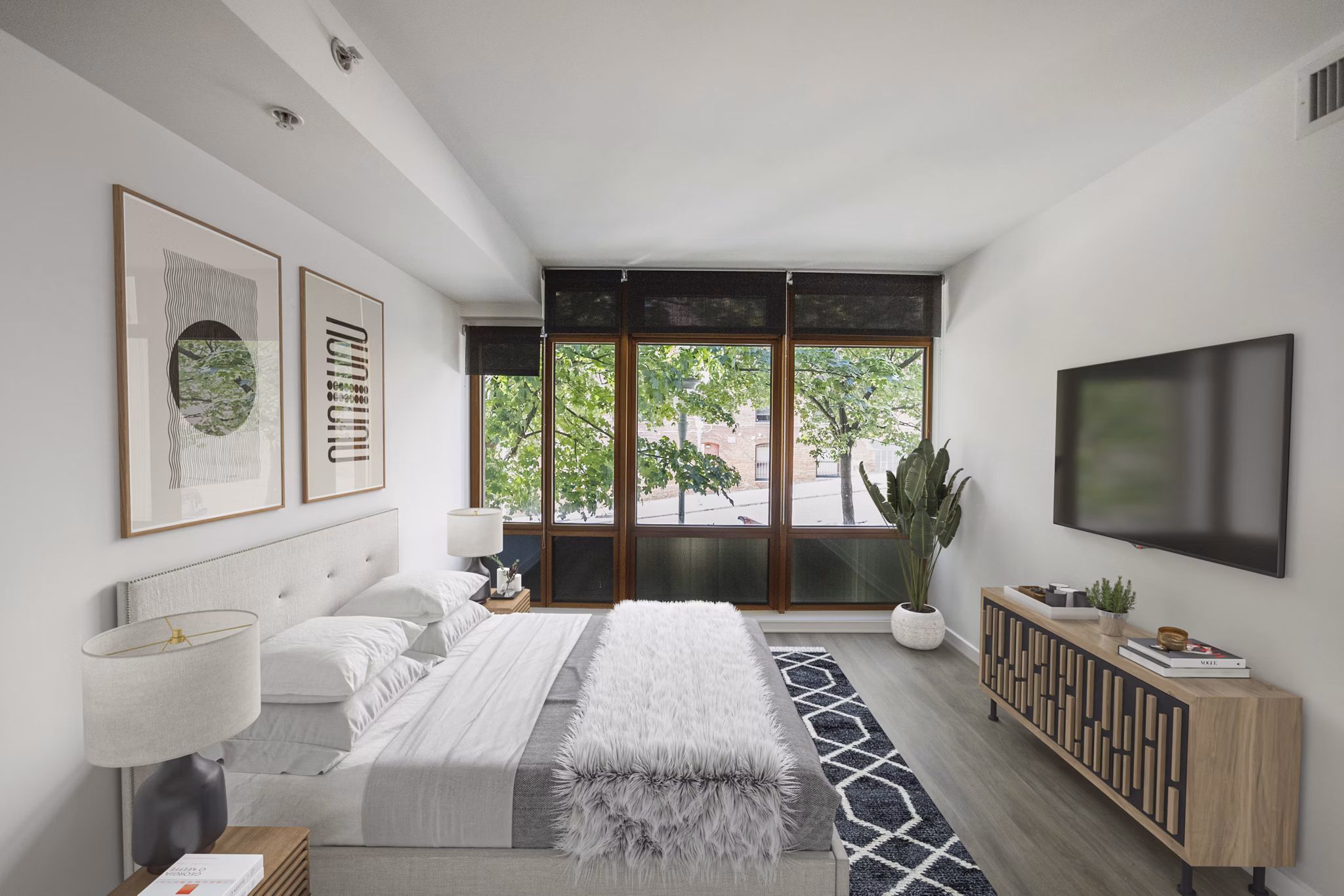 Bedroom featuring elegant decor and natural light at The Goodwin Apartments