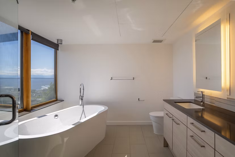 Modern bathroom featuring sleek fixtures at The Goodwin Apartments in a luxury setting