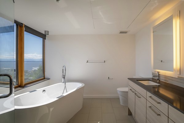 Modern bathroom featuring sleek fixtures at The Goodwin Apartments in a luxury setting