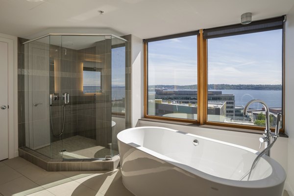 Modern bathroom with sleek fixtures and elegant tiles at The Goodwin Apartments