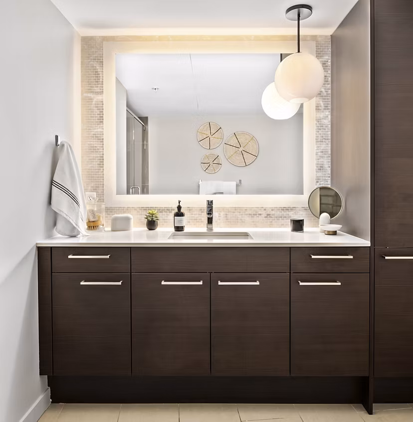 Bathroom featuring sleek fixtures and modern design at The Goodwin Apartments