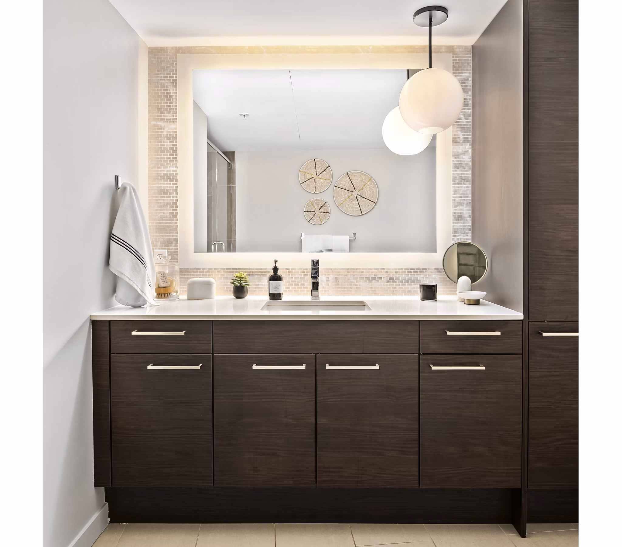 Bathroom featuring sleek fixtures and modern design at The Goodwin Apartments