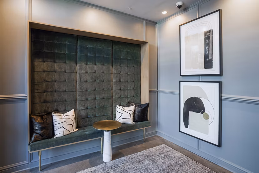 Clubhouse with modern decor and seating at The Goodwin Apartments