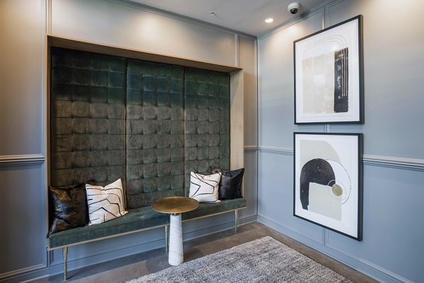 Clubhouse with modern decor and seating at The Goodwin Apartments