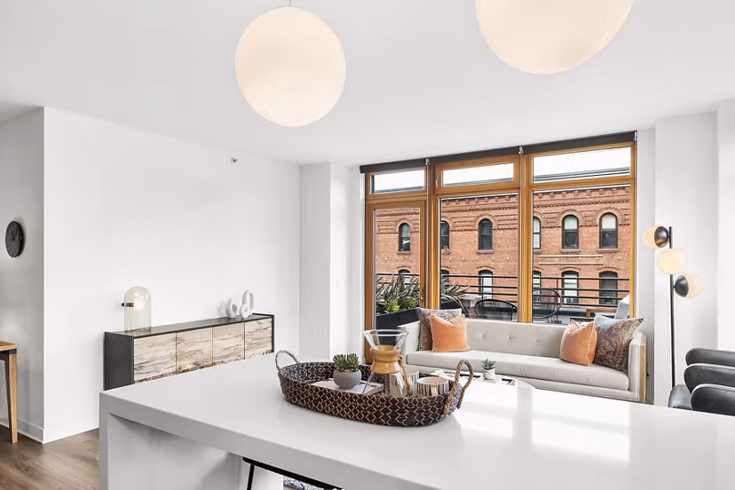 Modern kitchen with stainless steel appliances at The Goodwin Apartments