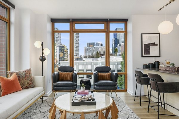 Spacious living room with modern decor at The Goodwin Apartments