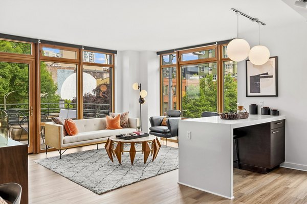Spacious living room with contemporary decor in The Goodwin Apartments