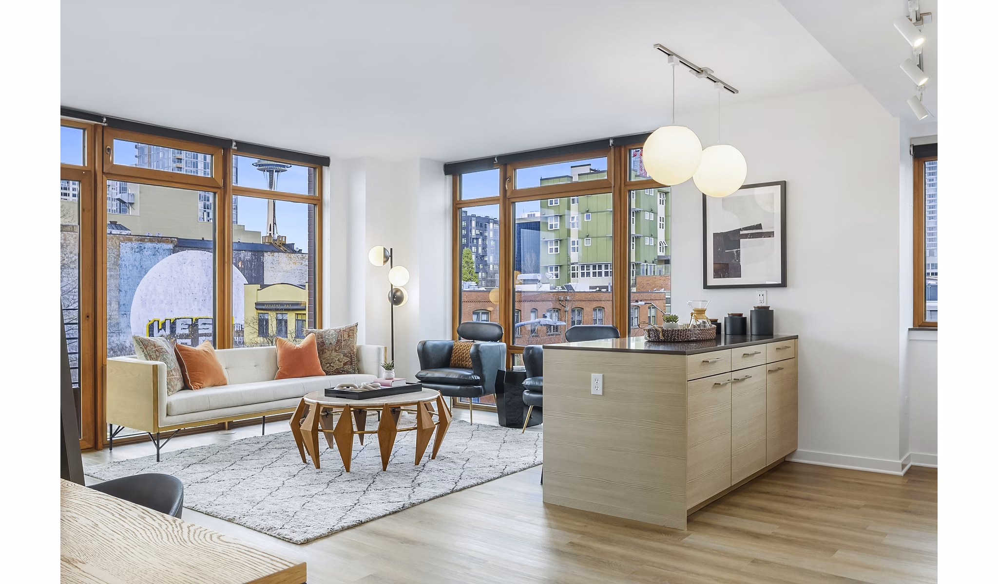 Spacious living room with modern decor at The Goodwin Apartments, featuring luxury finishes and ample natural light