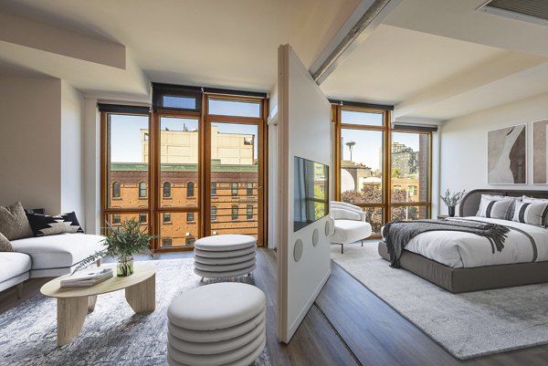 Spacious living room with modern decor in The Goodwin Apartments, offering luxury urban living