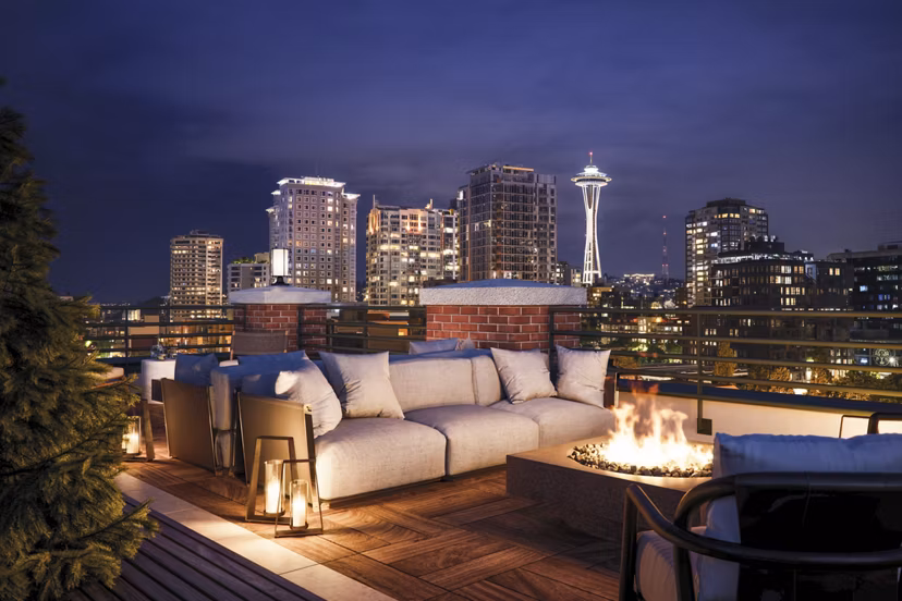 Cozy fire pit on the patio at The Goodwin Apartments, perfect for evening gatherings in a luxury setting