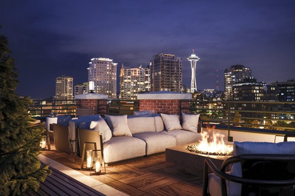 Cozy fire pit on the patio at The Goodwin Apartments, perfect for evening gatherings in a luxury setting