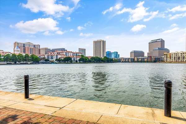 Lakeside Urban Center: Scenic view of modern luxury apartments with lush greenery