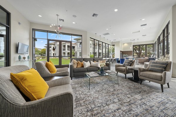 Clubhouse with modern design and seating area at Indigo Apartments offering luxury living in a vibrant community