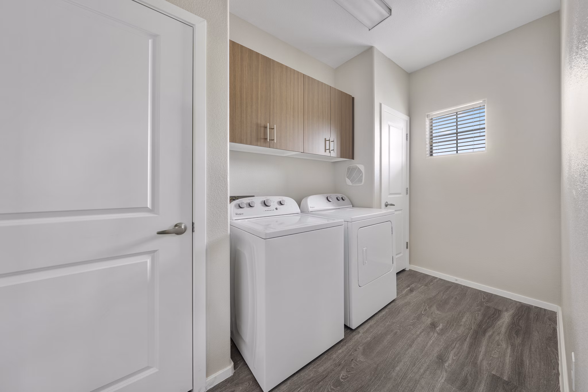 Laundry room featuring modern appliances at Indigo Apartments, a Greystar luxury community