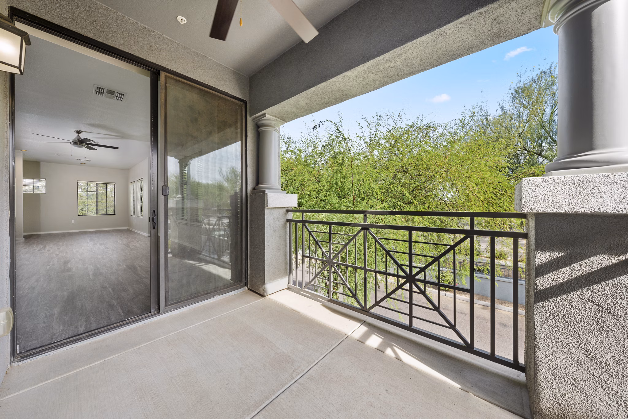 Modern patio with stylish seating at Indigo Apartments: luxury living in a serene environment
