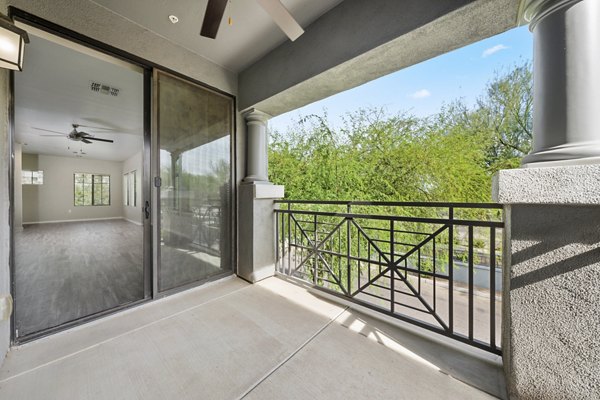 Modern patio with stylish seating at Indigo Apartments: luxury living in a serene environment