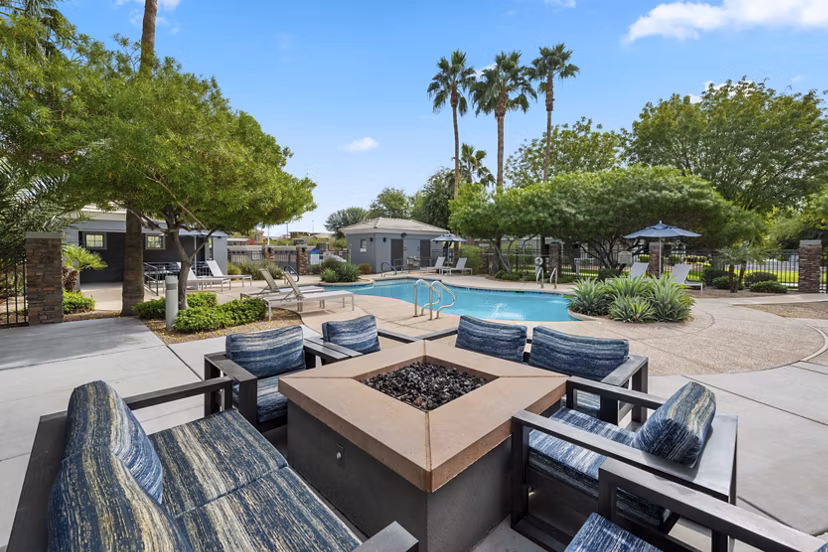 Cozy fire pit area at Indigo Apartments, a Greystar luxury community, perfect for relaxation and socializing outdoors