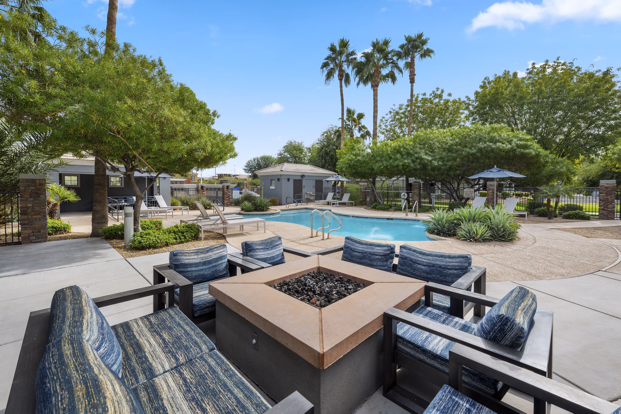 Cozy fire pit area at Indigo Apartments, a Greystar luxury community, perfect for relaxation and socializing outdoors