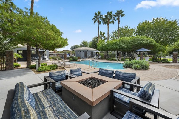 Cozy fire pit area at Indigo Apartments, a Greystar luxury community, perfect for relaxation and socializing outdoors