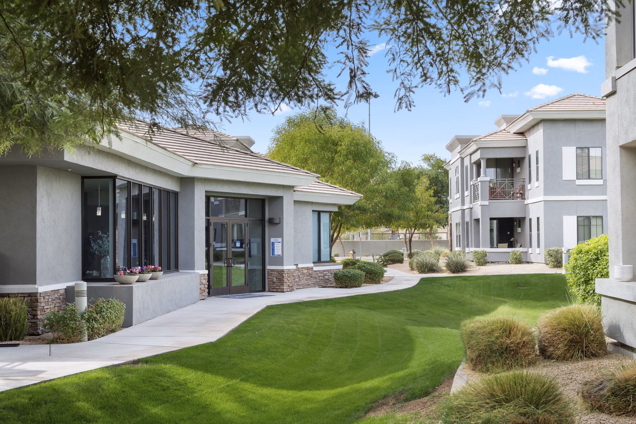 Indigo Apartments: Tranquil courtyard with lush landscaping in a luxury setting