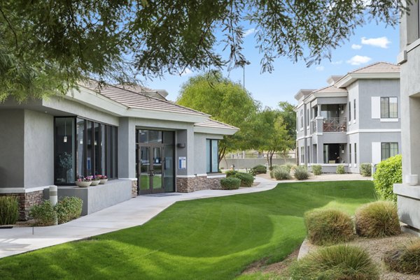 Indigo Apartments: Tranquil courtyard with lush landscaping in a luxury setting