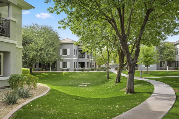 Indigo Apartments: Lush courtyard with garden pathways for luxury living