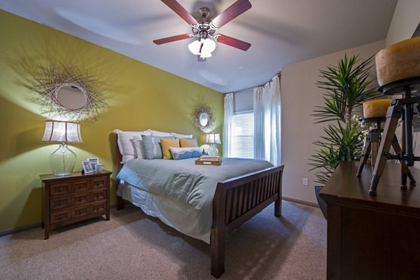 Spacious bedroom with modern decor at Montage at Cinco Ranch Apartments, ideal for luxury living near local attractions
