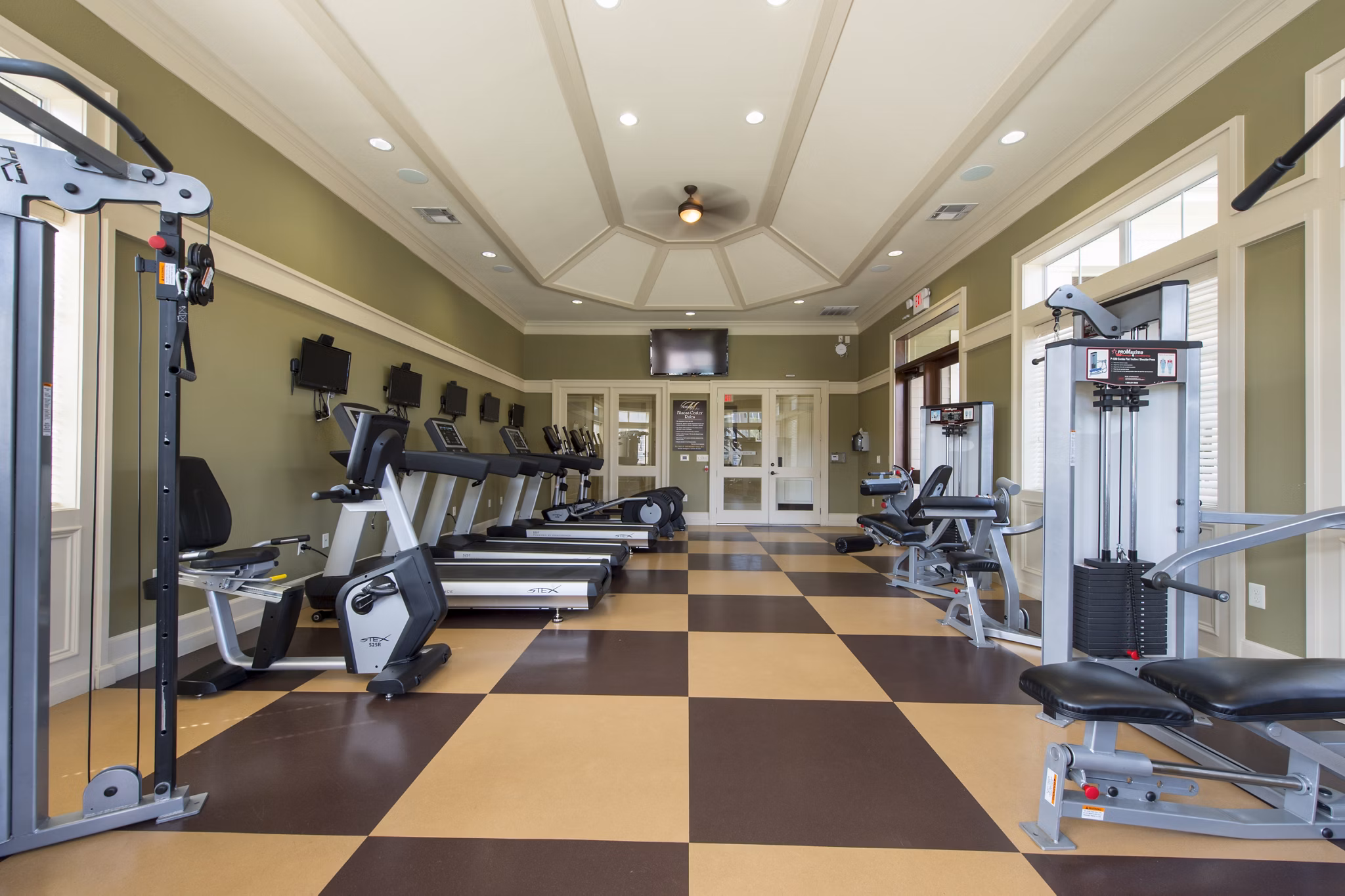 Modern fitness center with state-of-the-art equipment at Montage at Cinco Ranch Apartments