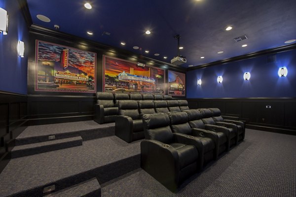 Theater with plush seating and large screen at Montage at Cinco Ranch Apartments