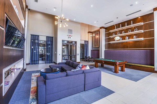 Elegant clubhouse with modern furnishings at The Four Apartments, featuring luxury amenities for residents in a welcoming social space