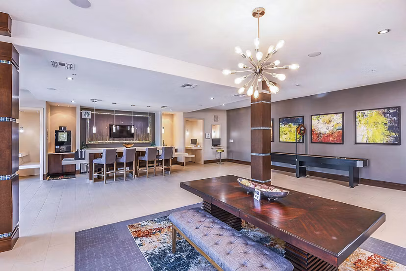Modern clubhouse with elegant furnishings at The Four Apartments, showcasing luxury amenities for residents