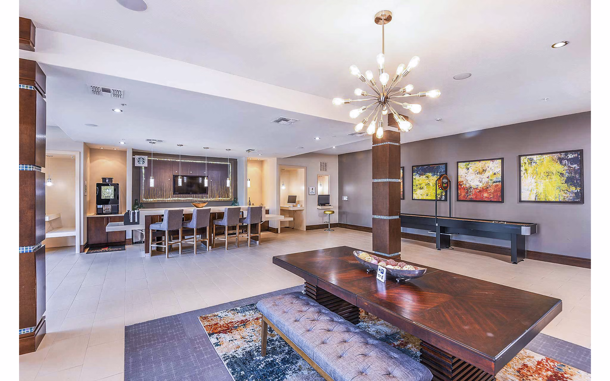 Modern clubhouse with elegant furnishings at The Four Apartments, showcasing luxury amenities for residents