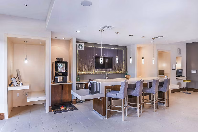 Clubhouse with modern furnishings at The Four Apartments, a luxury property by Greystar