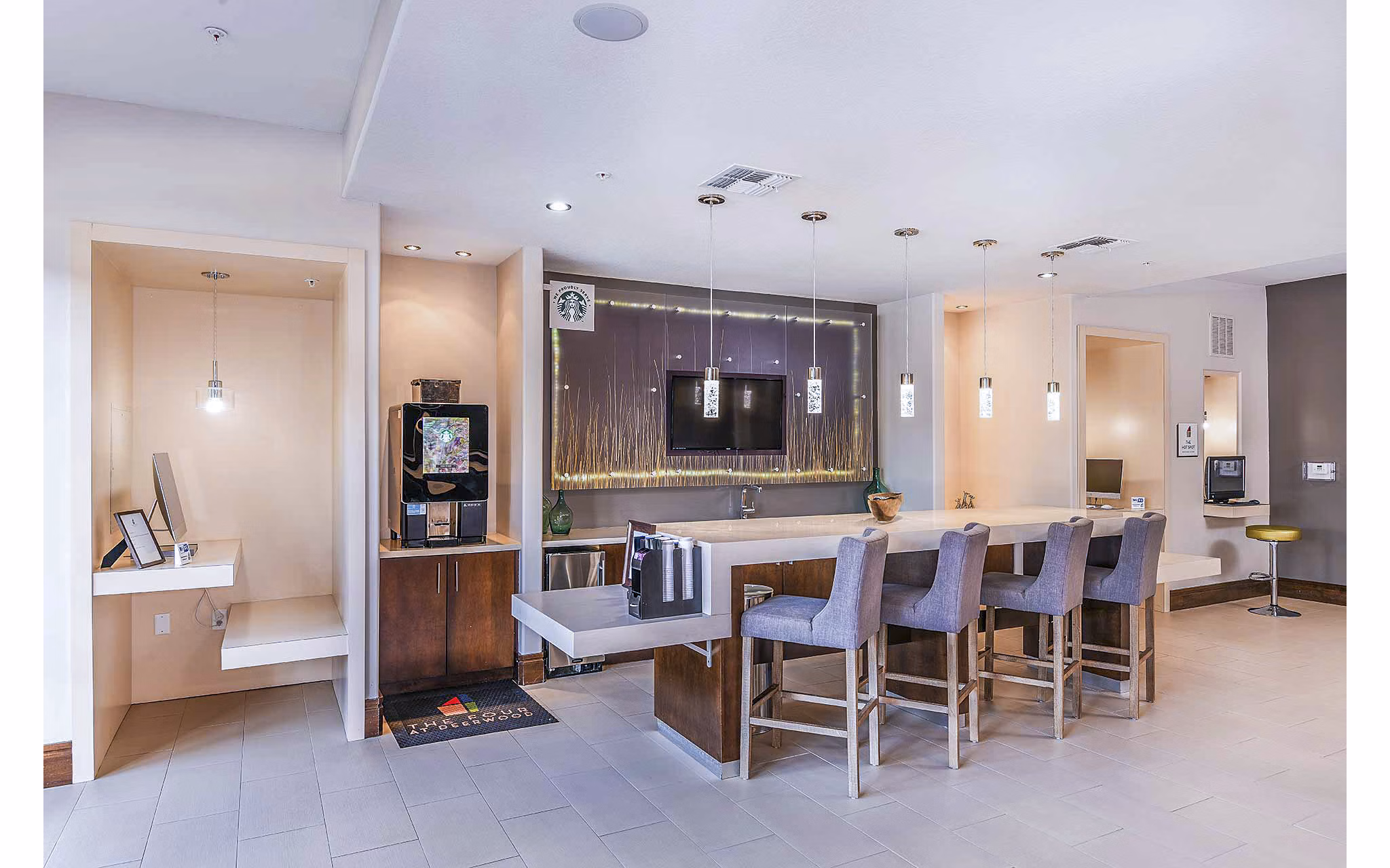 Clubhouse with modern furnishings at The Four Apartments, a luxury property by Greystar
