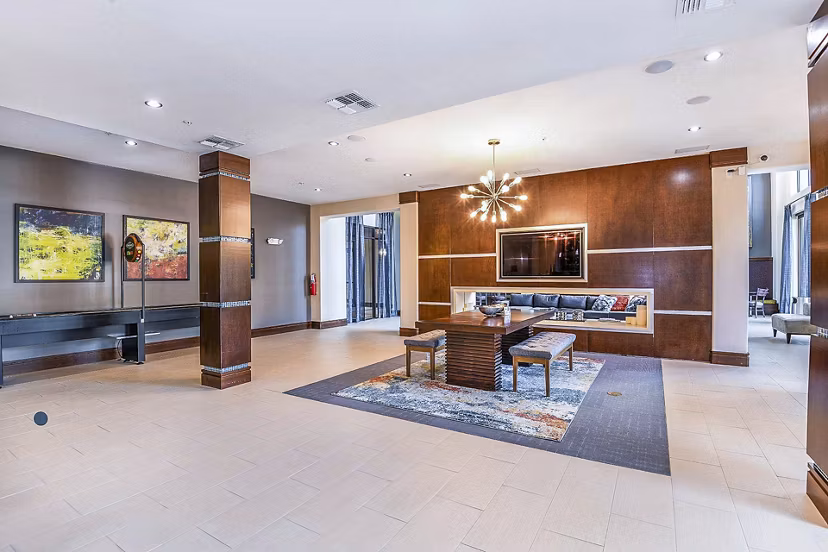 Clubhouse featuring modern design and cozy seating at The Four Apartments