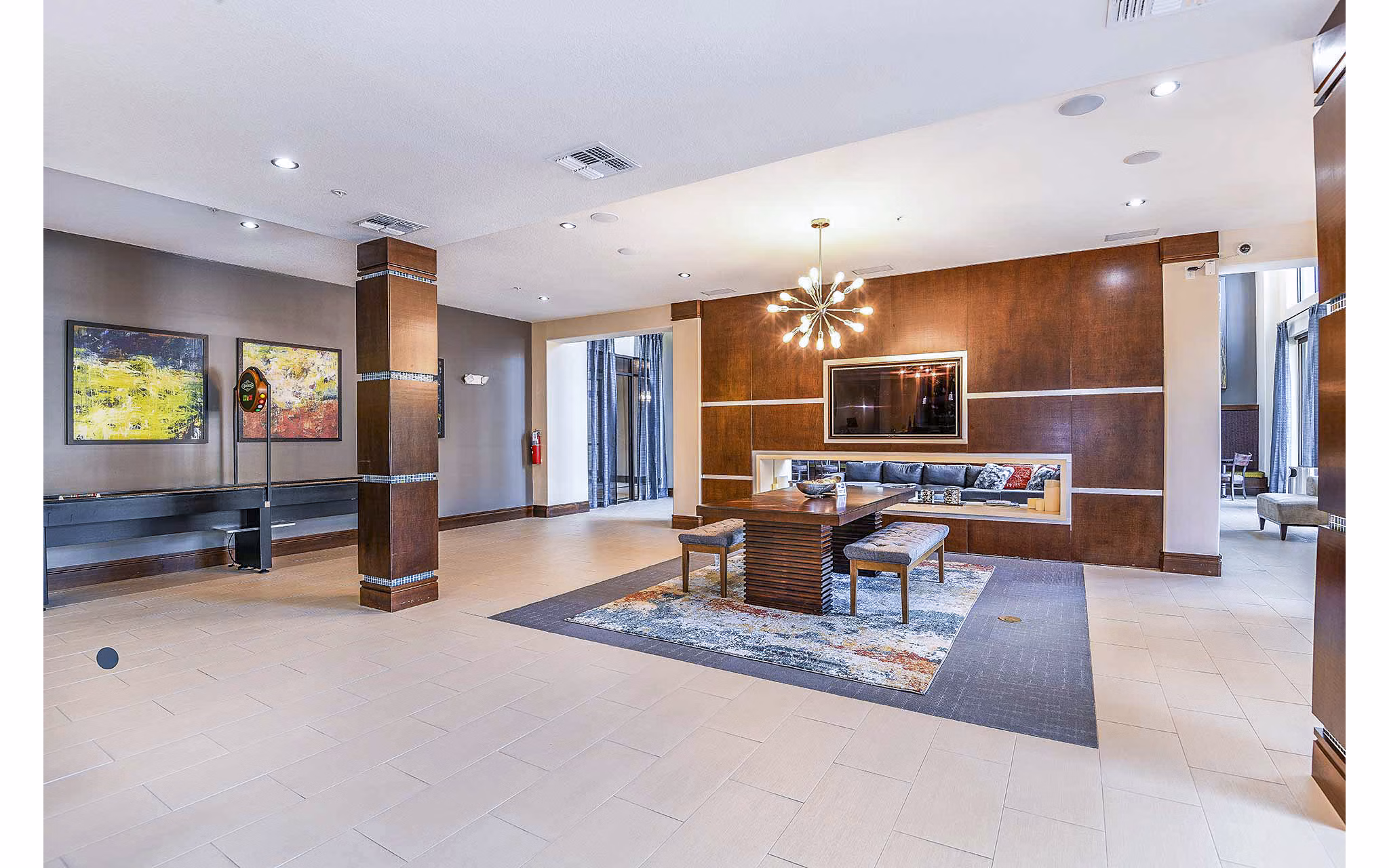 Clubhouse featuring modern design and cozy seating at The Four Apartments