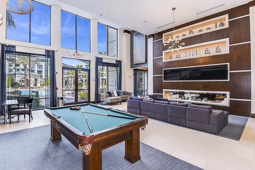 Clubhouse featuring modern design and community seating at The Four Apartments