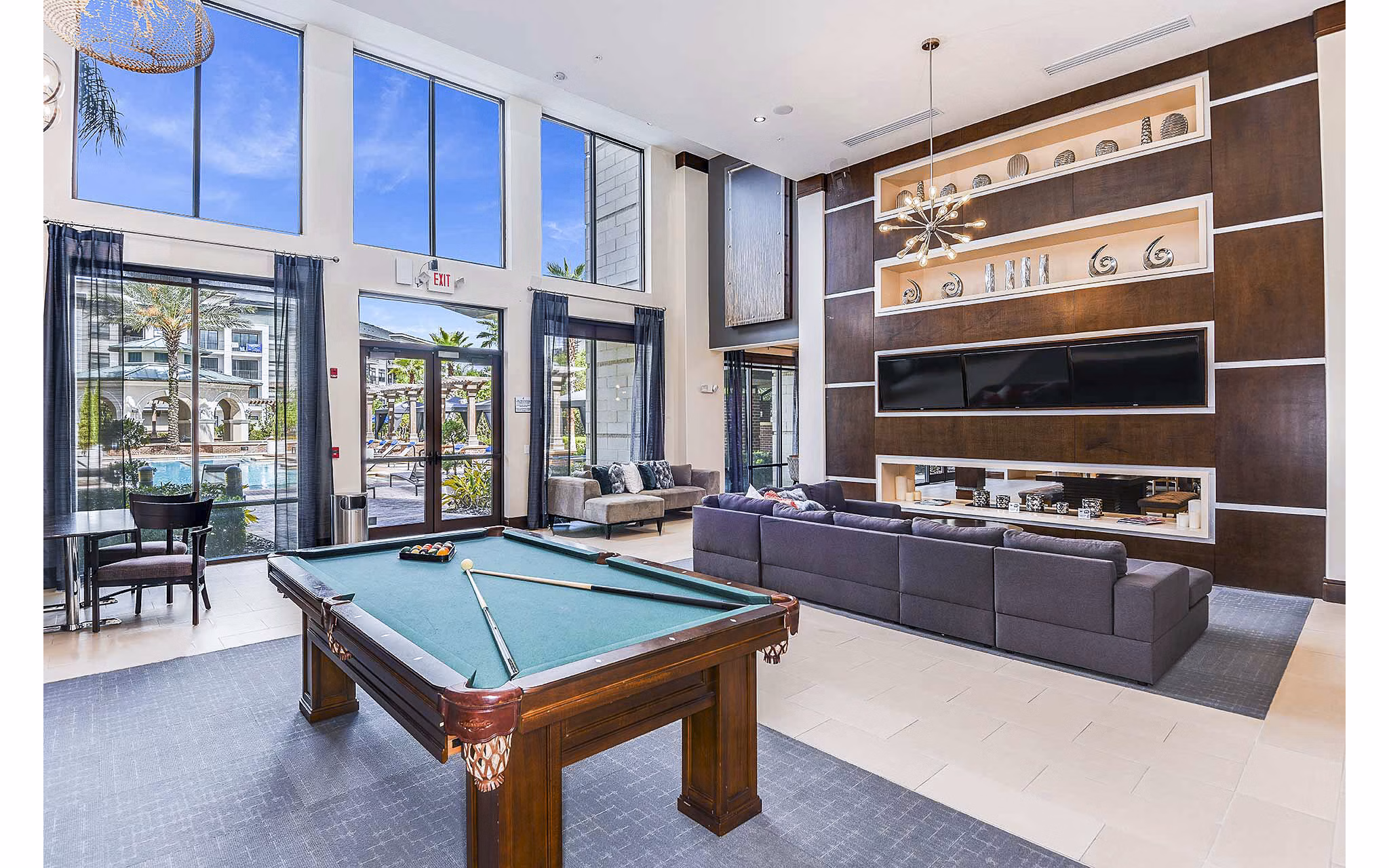 Clubhouse featuring modern design and community seating at The Four Apartments